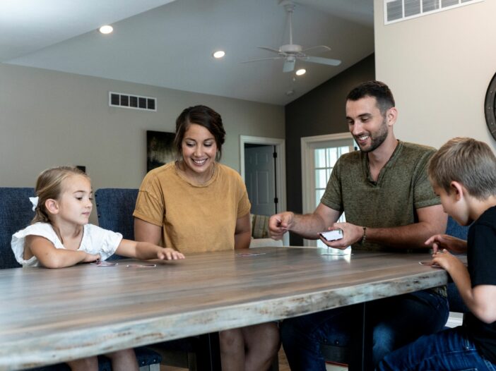 family around Amish made table