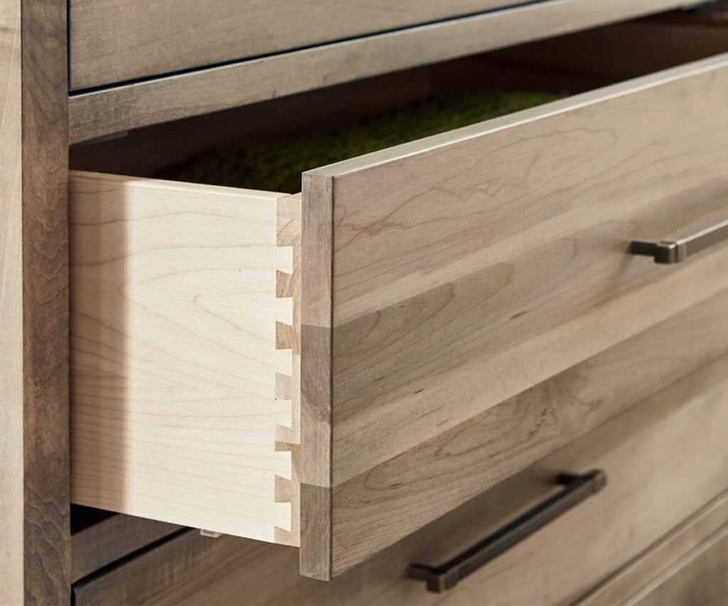 Open dresser drawer showing dovetail joinery, an easy sign of quality construction.