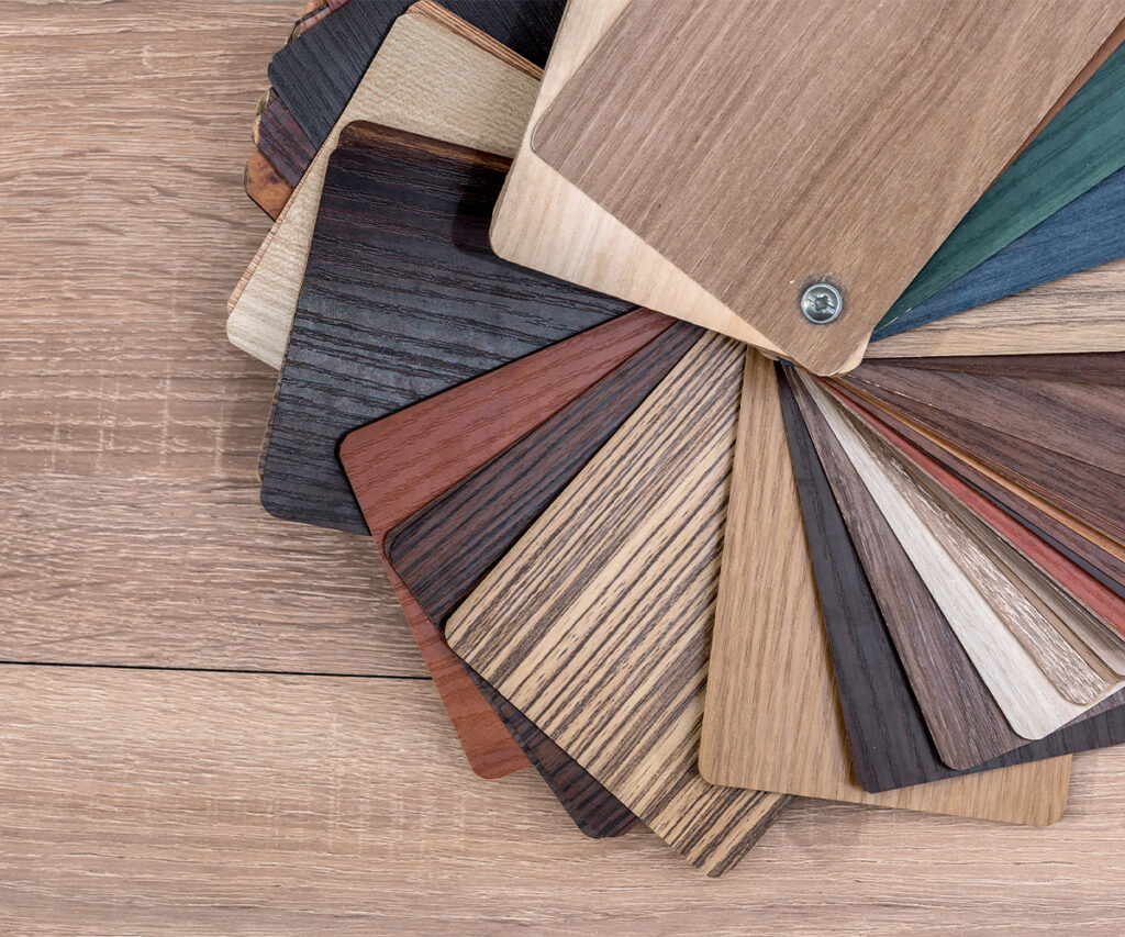 Fan of wood and stain samples on a tabletop